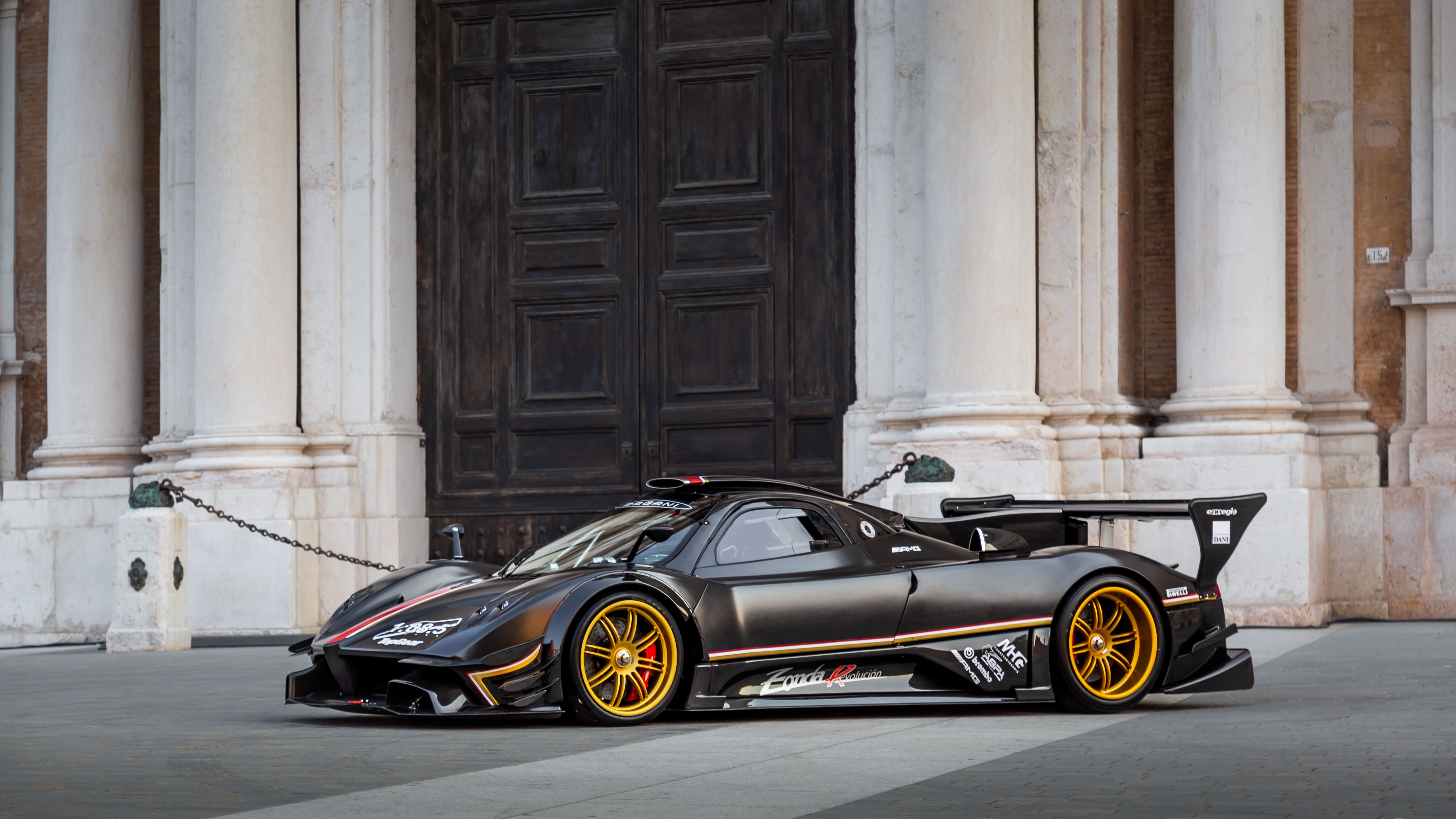 Pagani Zonda Revolución side profile showing the large rear wing and gold wheels